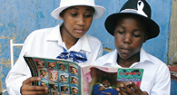 Kids reading the Globe