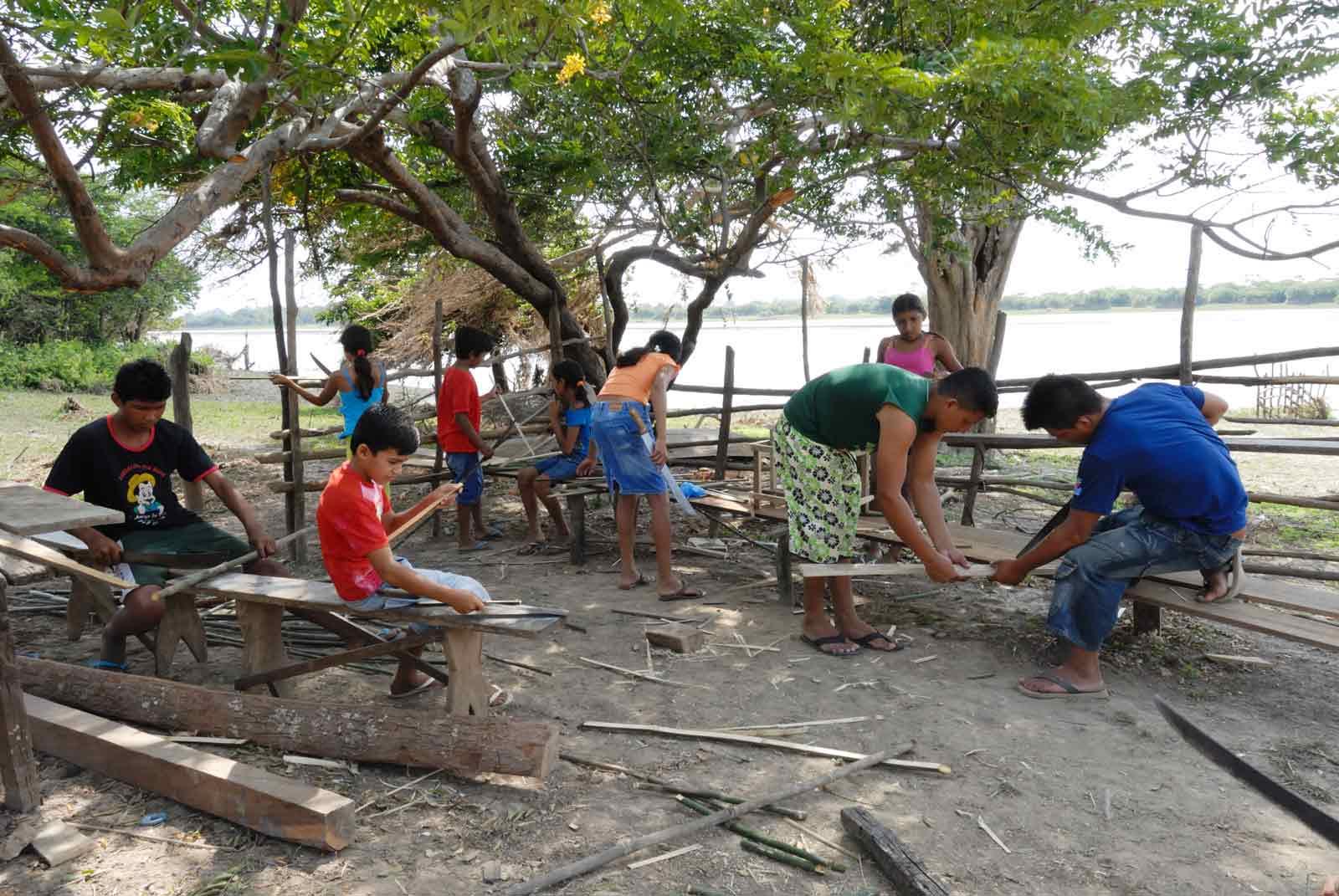 a group people building with planks.