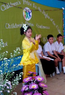 Burmese child dances at press conference