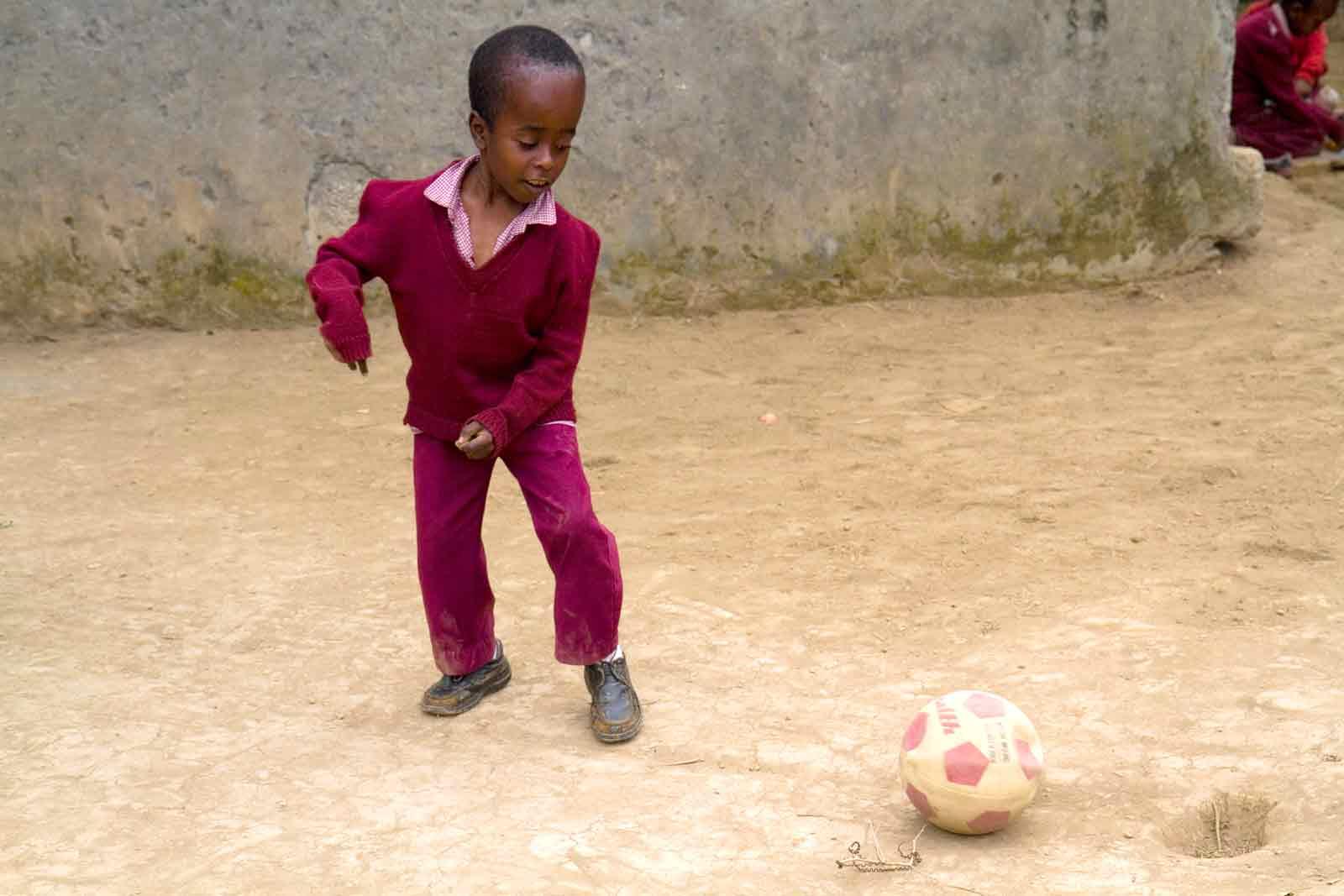 Boy with disabilities plays football