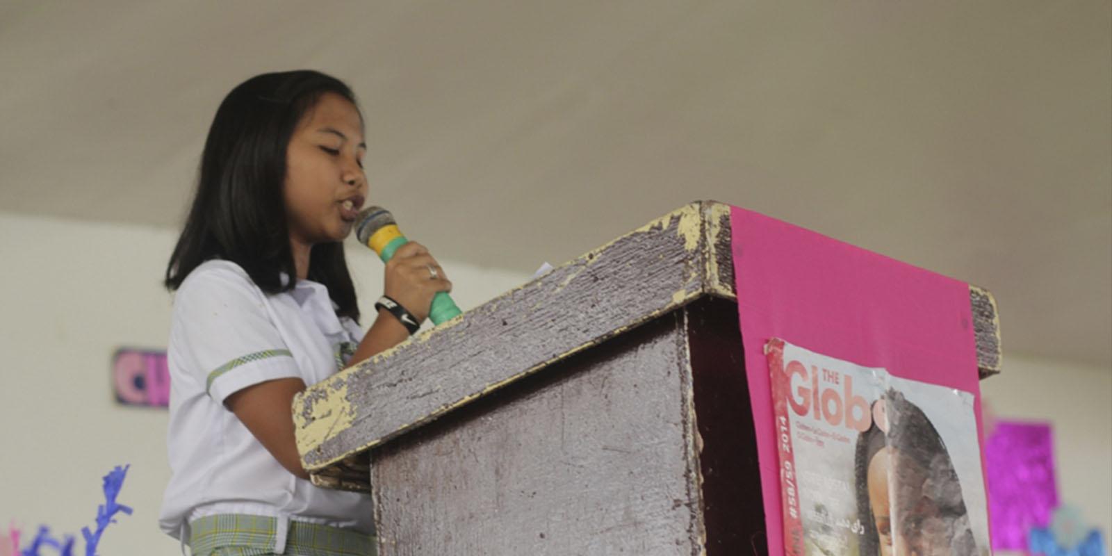 Girl on podium speaking