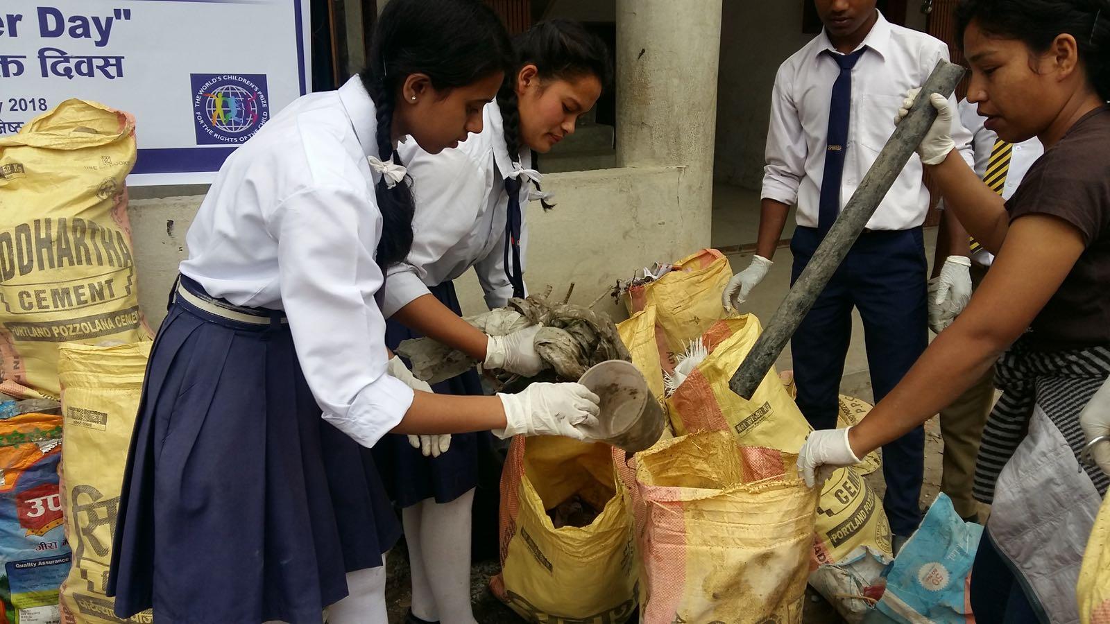 Children collecting trash
