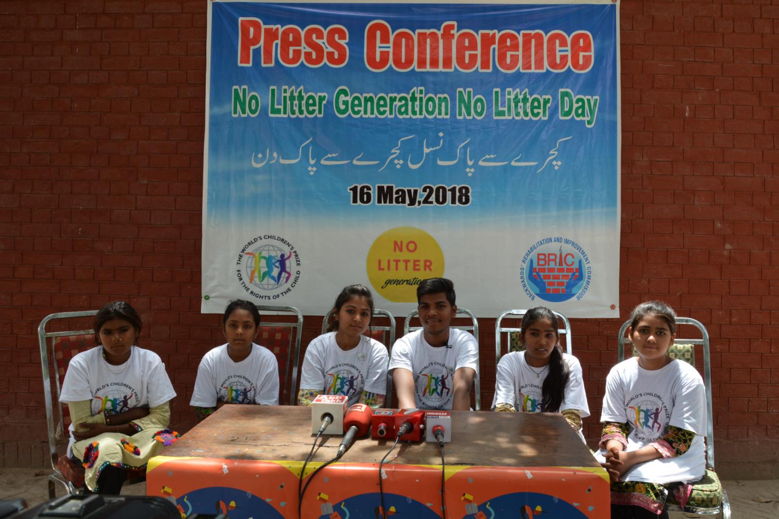 No Litter Day press conference, children sitting at a table with microphones