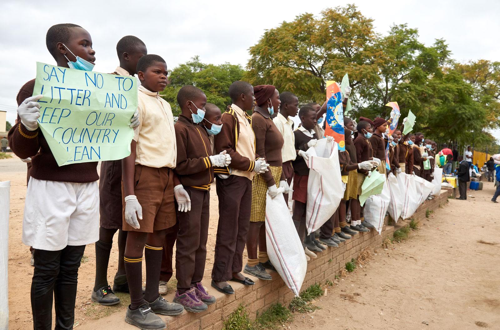 Children demonstrating with signs