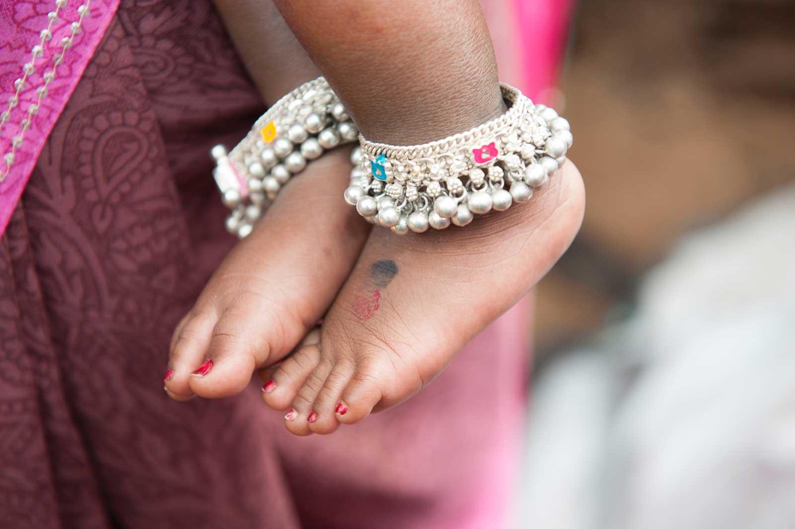 Baby feet with bangles around ancles