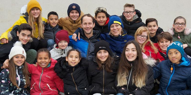 Olympians with school children group photo