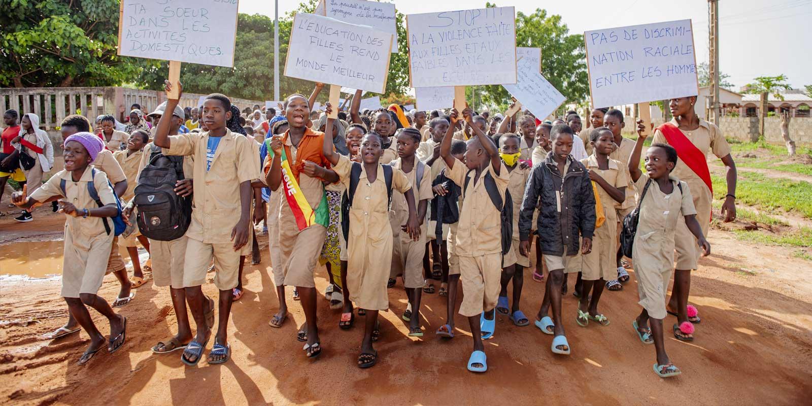 Children in Africa rallying for education. 