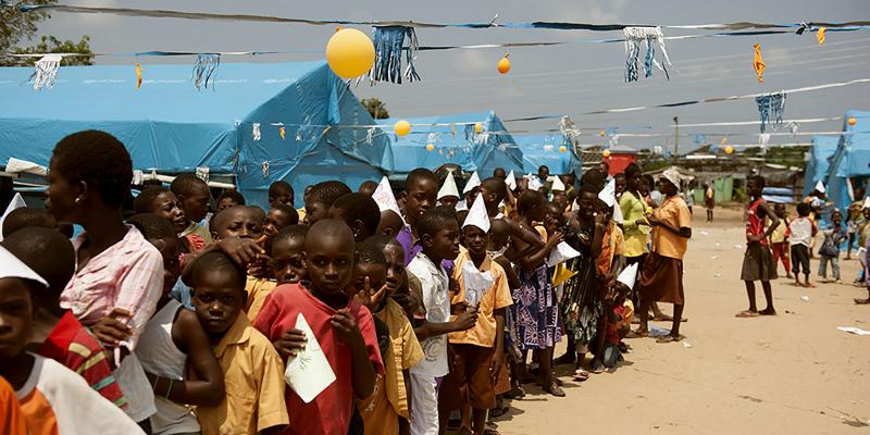 Children queing up to vote in a refugee camp