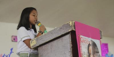 Girl on podium speaking