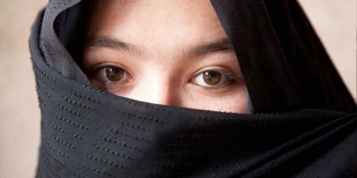 Girl in black shawl.