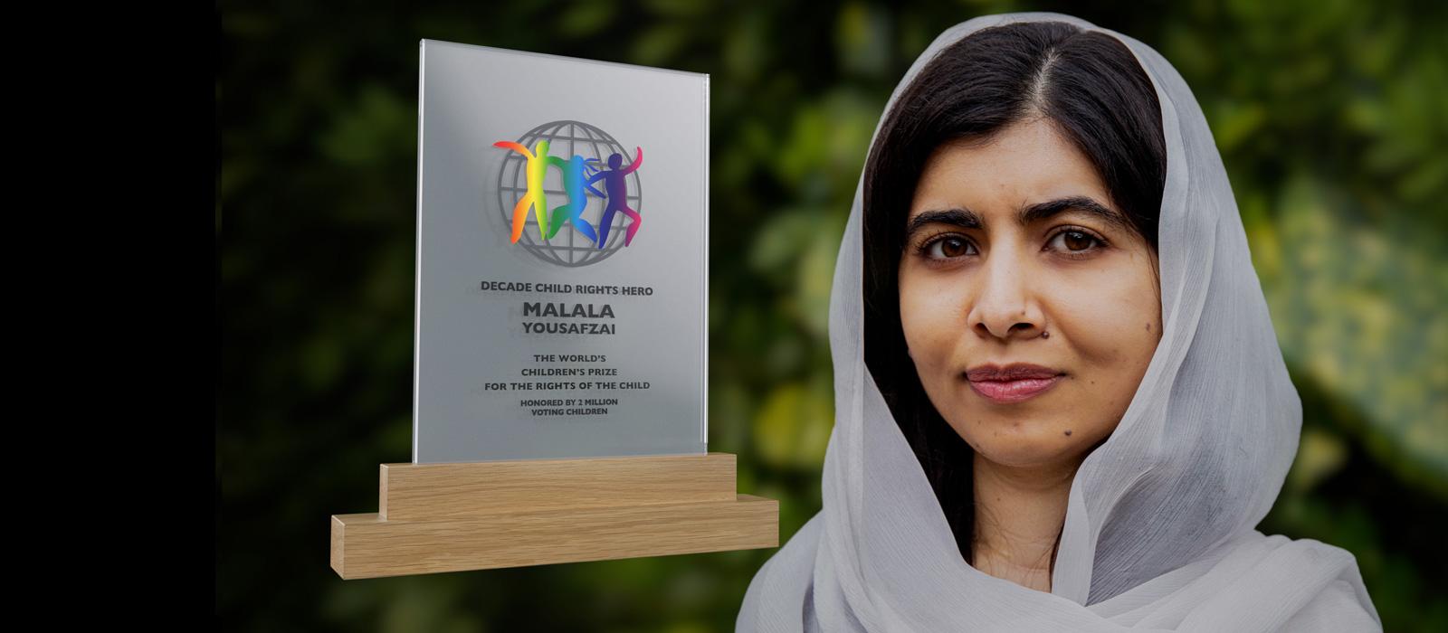 Malala with white veil, next to award. 