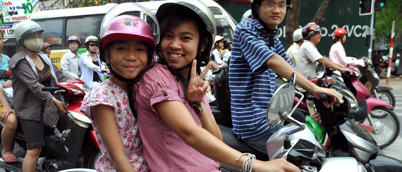 Two girls on a motorbike in Hanoi