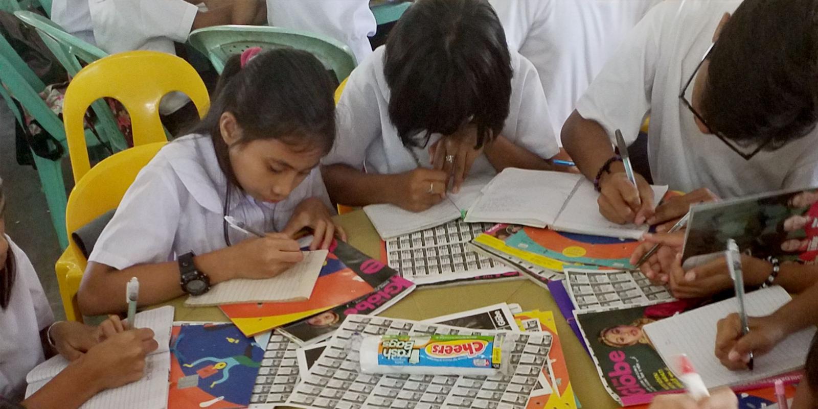 Children writing on paper