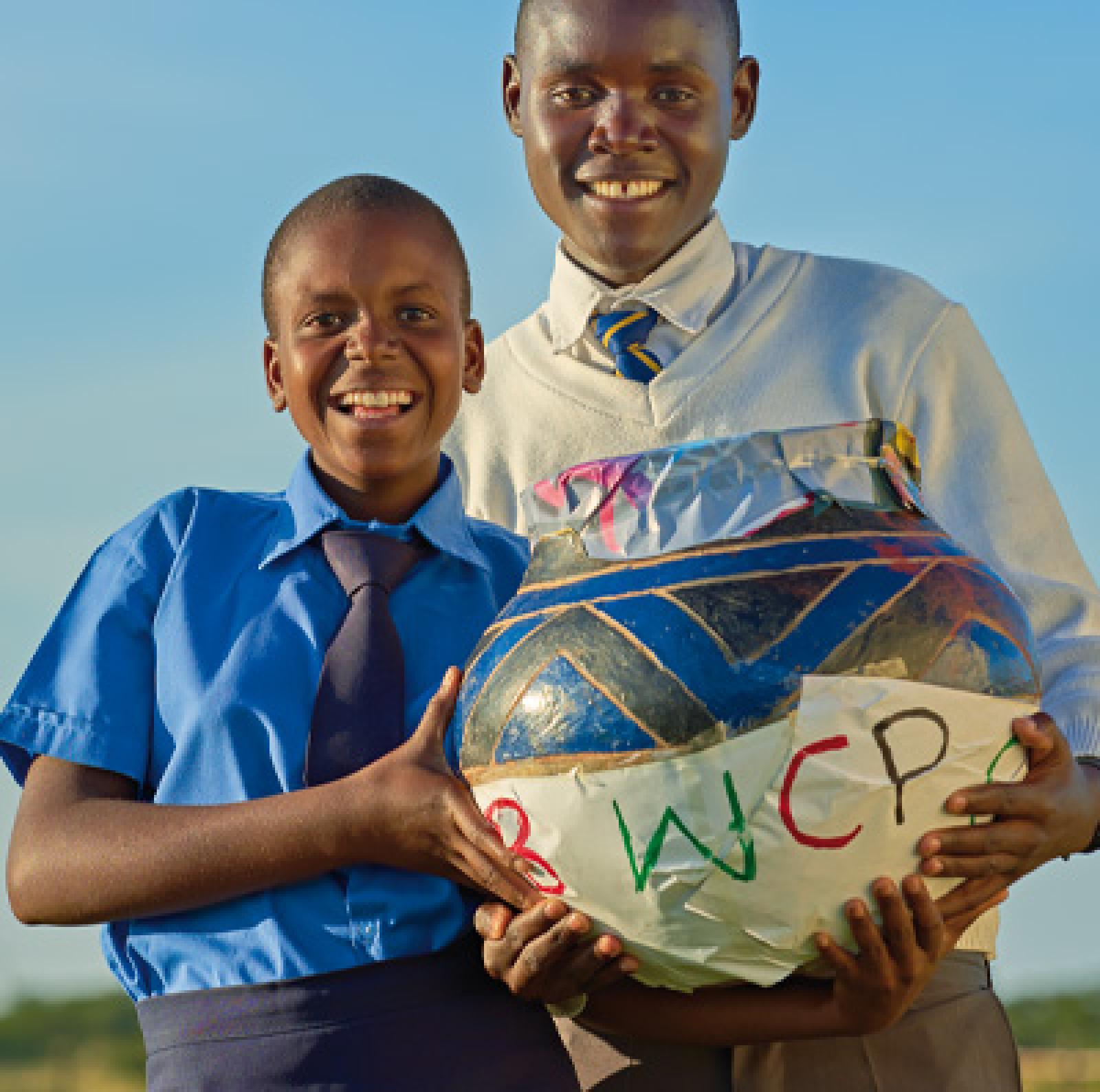 Girl and boy holding ballot box